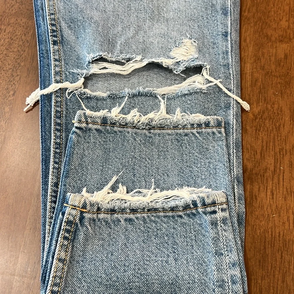Bershka mom jeans high rise.  with rip in blue. Busted knee Size 4